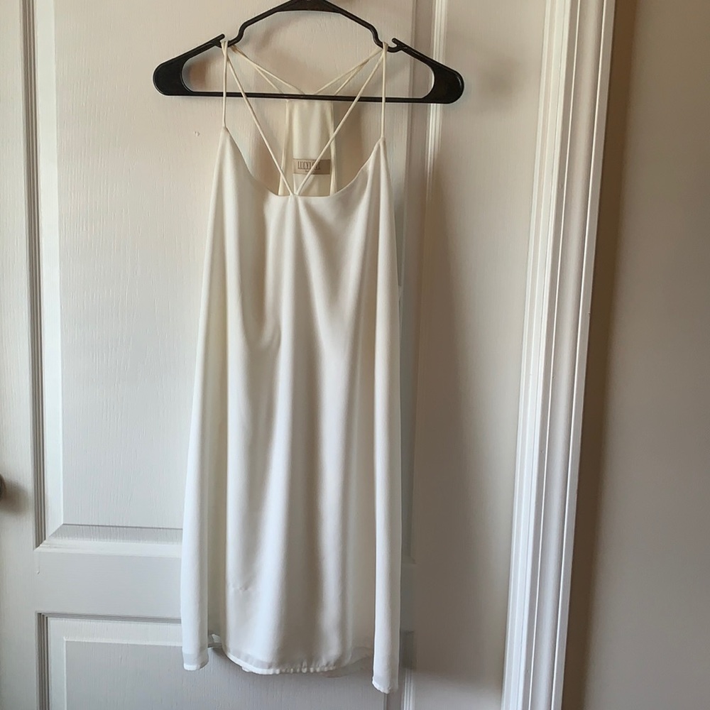 White dress. Slight Discoloration, and Pull